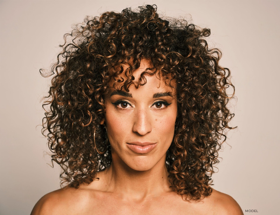 stock image of African american model with curly hair