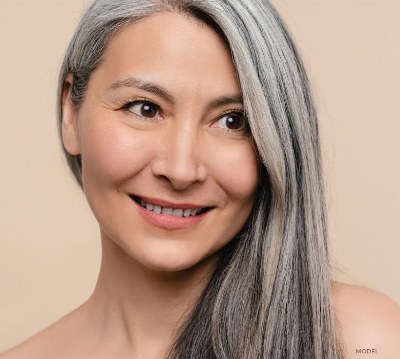 stock image of Asian model with white hair