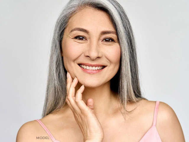 stock image of model smiling with white hair