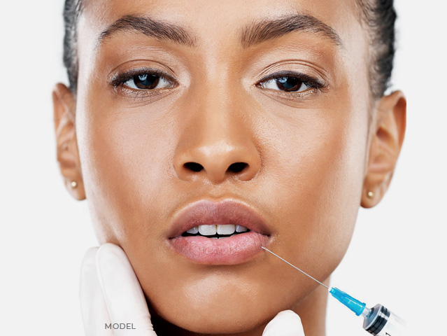 Stock image of model having her non surgical injection