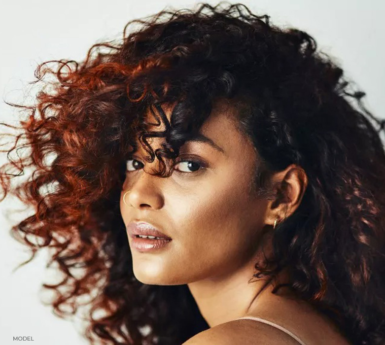 stock image of model with curly hair