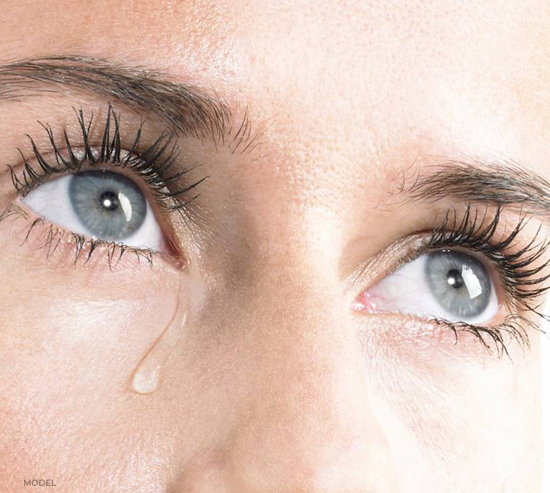 stock image of model showing her two eyes